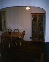 Wide shot of the drop leaf table I built of solid read oak and the china cabinet I built. 
