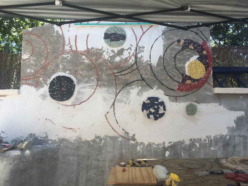 First tiles being adhered to the wall! 