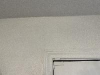 Closeup showing an invisible drywall crack repair. 