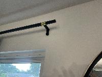 After opening up the crack a bit, adding drywall compound, and then paint, the fix is invisible.