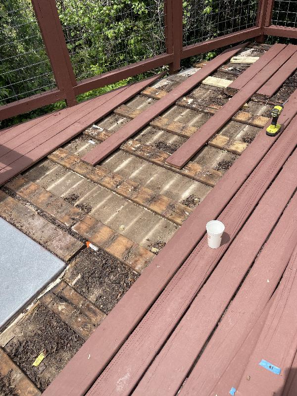 The roof is sloped very slightly for drainage, but the debris has kept that from being very effective. 