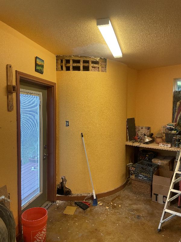 More damage detected inside near bottom of wall. 