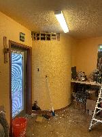 More damage detected inside near bottom of wall. 