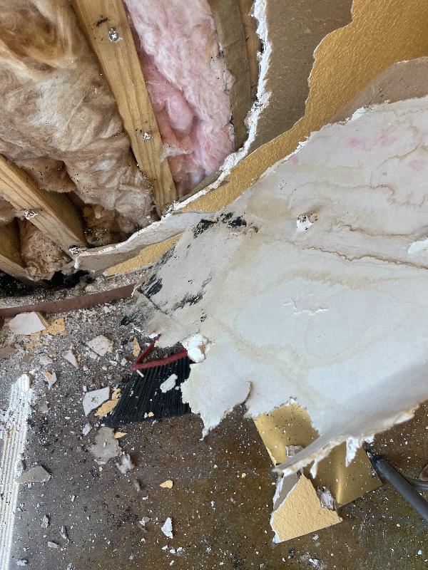 Water marks down the inside of the drywall. 