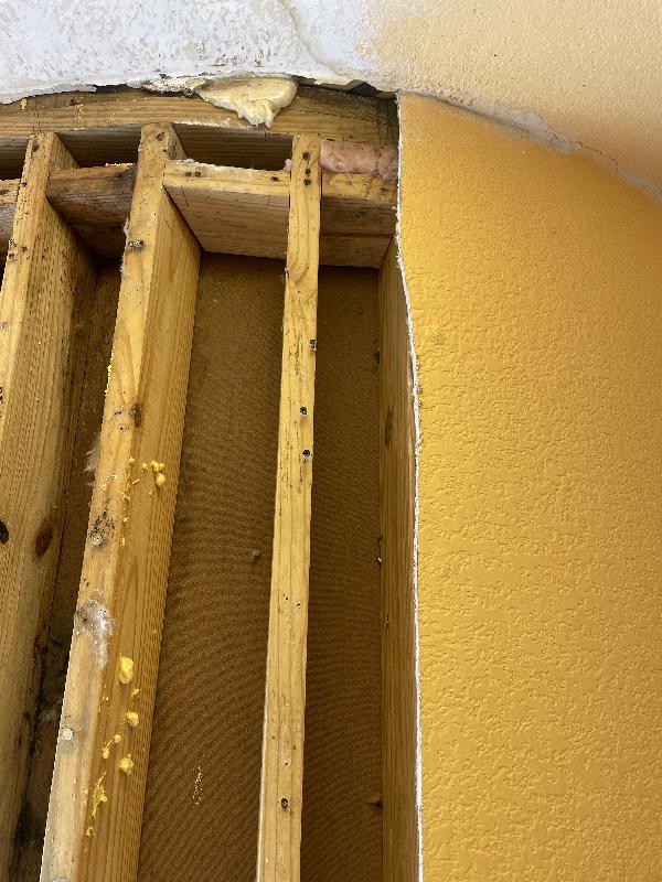 Mostly dry at the top - some water marks in ceiling 