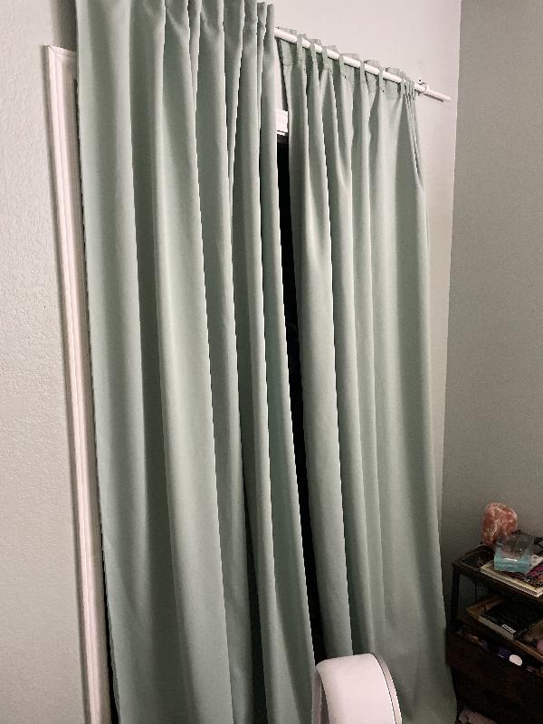 There used to be bifold doors here. They are not in the shed. The curtains are somewhat haphazard 