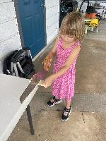 Here's the owner's daughter. She's so curious! I taught her to saw.