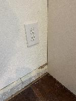 Asked the client what to do about this outlet. They decided to just cut a hole in the cabinet in case they needed to access it.  