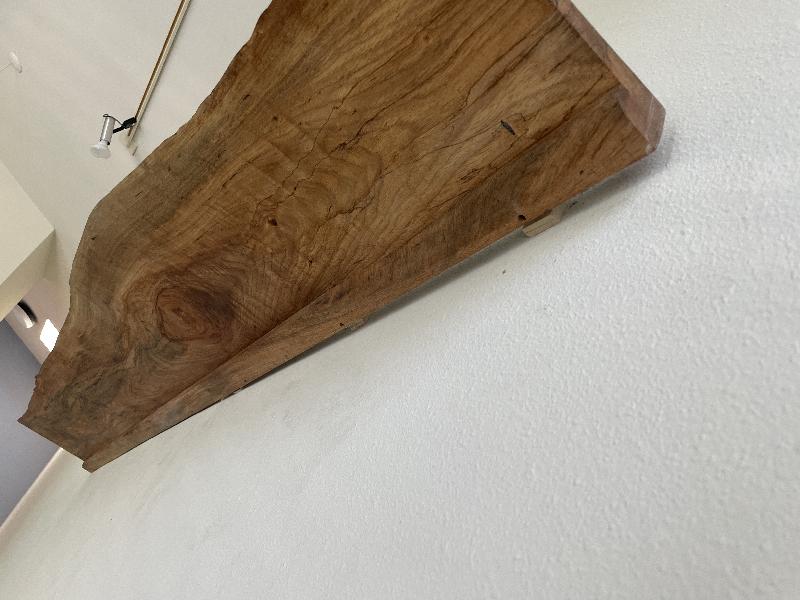 Showing the gap where the wall isn't straight.