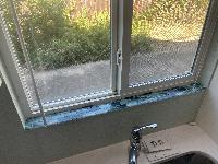 Windowsill tiles laid out ready to install 