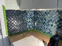 Starting to apply grout 