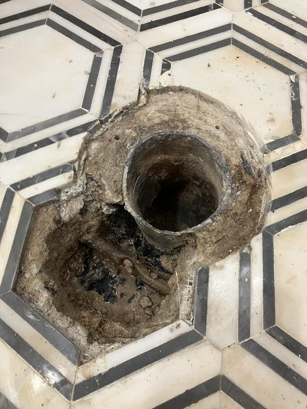 I used my hammer drill and a chisel to remove concrete until I found the water line.