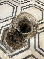 I used my hammer drill and a chisel to remove concrete until I found the water line.