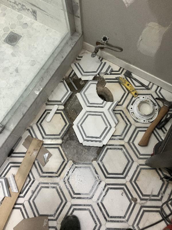 Starting to set new tile. Thank goodness the owners had extra tile!