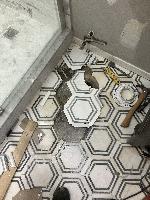 Starting to set new tile. Thank goodness the owners had extra tile!