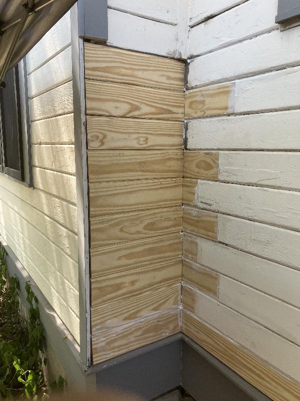 Siding installed and caulked, ready for paint. 