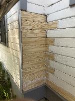 Siding installed and caulked, ready for paint. 