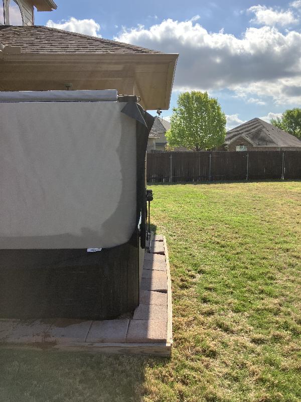 The current pavers are just barely wider than the tub itself.
