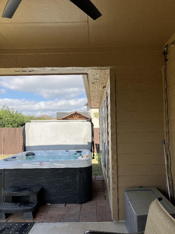Showing the narrow space between the tub and the house. The client suggested that we protect the screens and windows with plywood to avoid accidental damage.