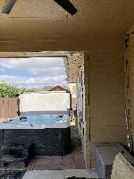 Showing the narrow space between the tub and the house. The client suggested that we protect the screens and windows with plywood to avoid accidental damage. 