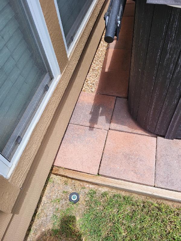 During a phone call, the client let me know we **CANNOT** move the tub, so the footing has to fit here. We have to be careful of the sprinkler head as well.